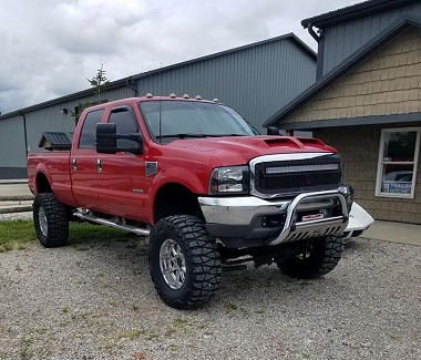 red truck with lift kit installed